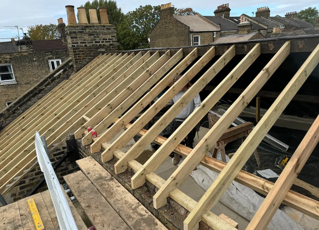The structural timber geometry of a London roof under construction